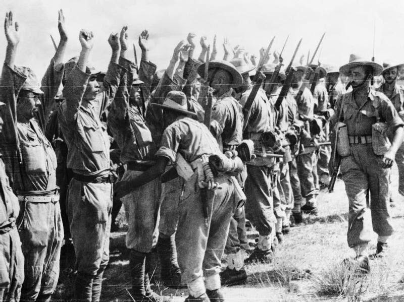 Japanese Prisoners of War Soldiers of the Royal Garhwal Rifles search Japanese soldiers at Kuala Lumpur, Malaysia